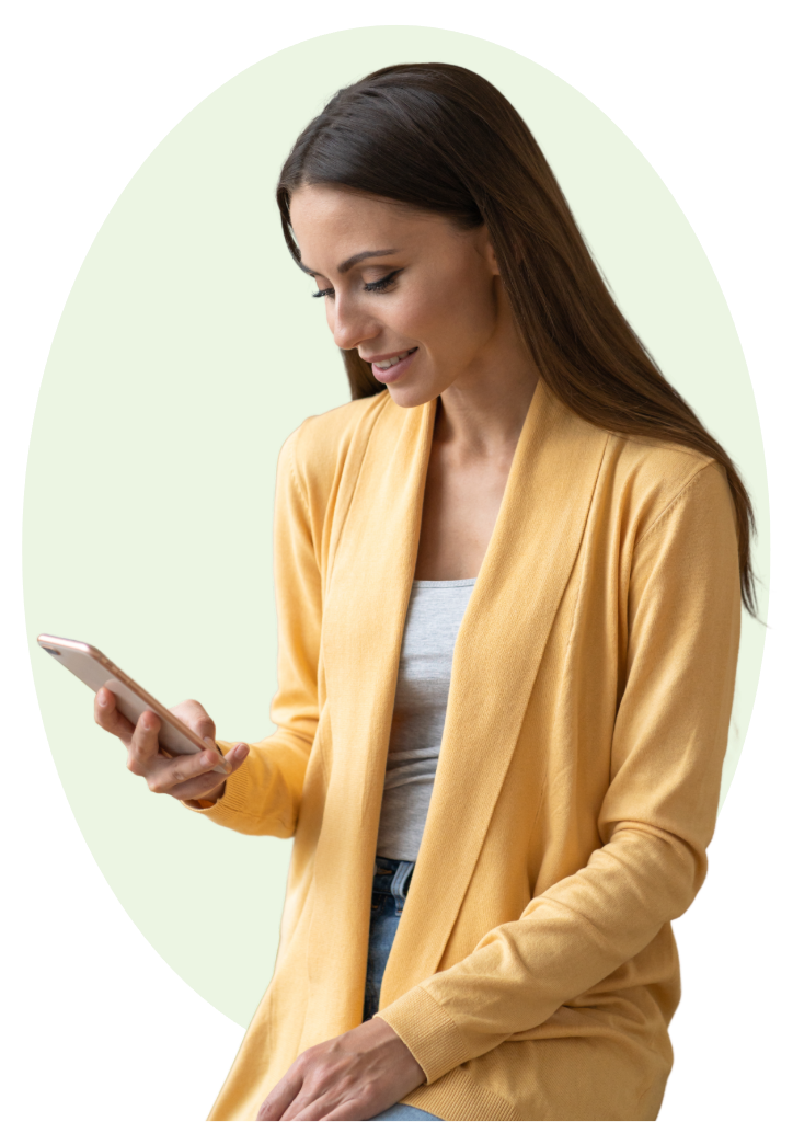 A smiling woman looking at Quiet Lock on her phone